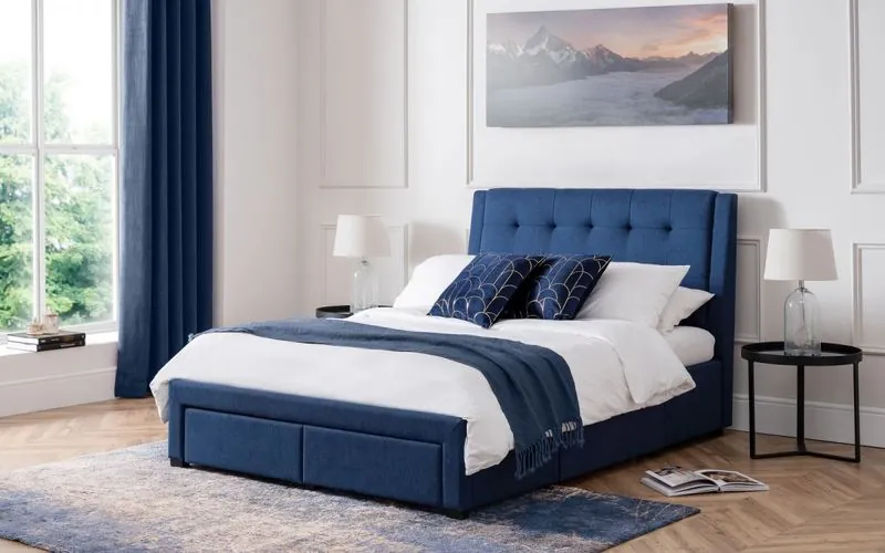 Hybrid mattress on an upholstered bed in a bright bedroom