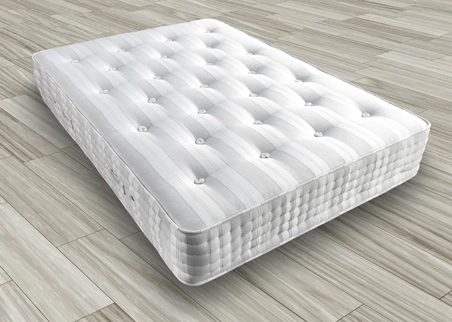 Quilted, tufted hybrid mattress top showing the stitched comfort layer