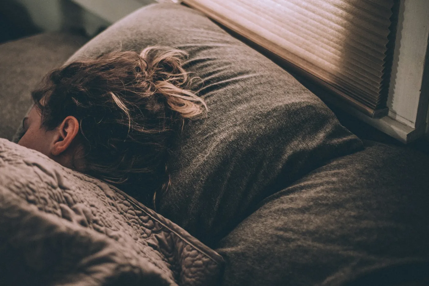 Woman sleeping peacefully on a comfortable mattress